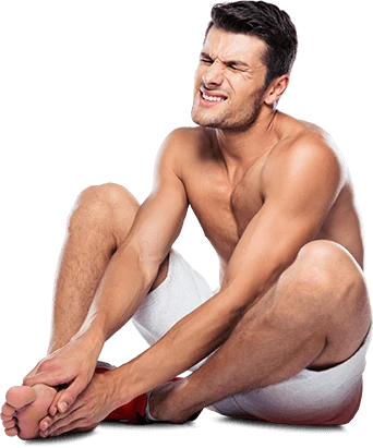 Silhouette d'un homme tenant sa jambe, symbolisant la douleur articulaire